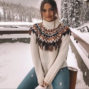 Turtleneck fringe sweater